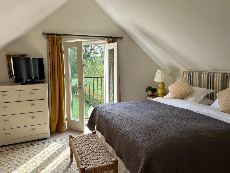 Geiger bedroom is one of 3 luxury en-suite bedrooms in Garden Cottage, a stylish holiday home in rural Herefordshire | Monnington House