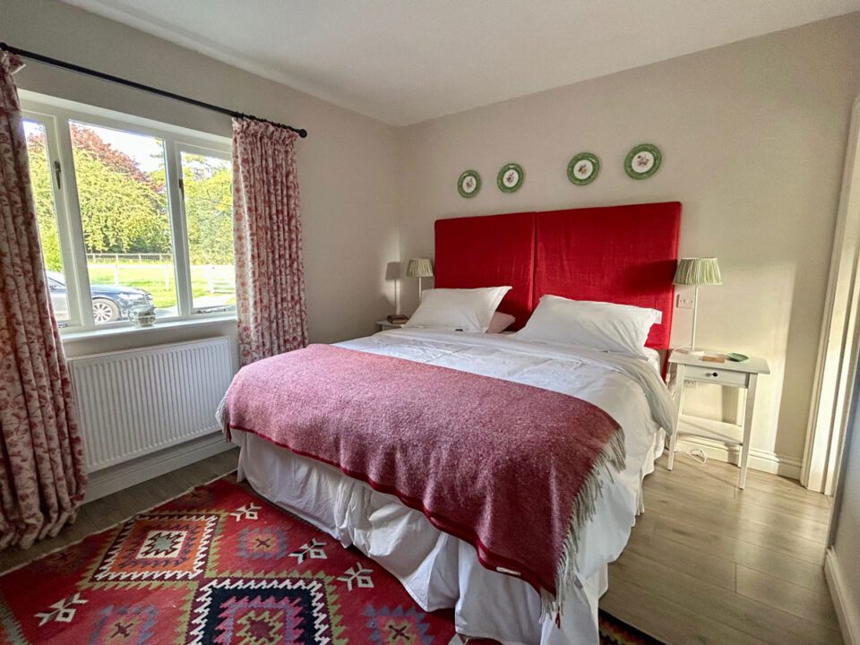 Tearose bedroom in The Cider Mill. A rural holiday cottage that sleeps 6 guests and has an enclosed garden | Monnington House, Herefordshire